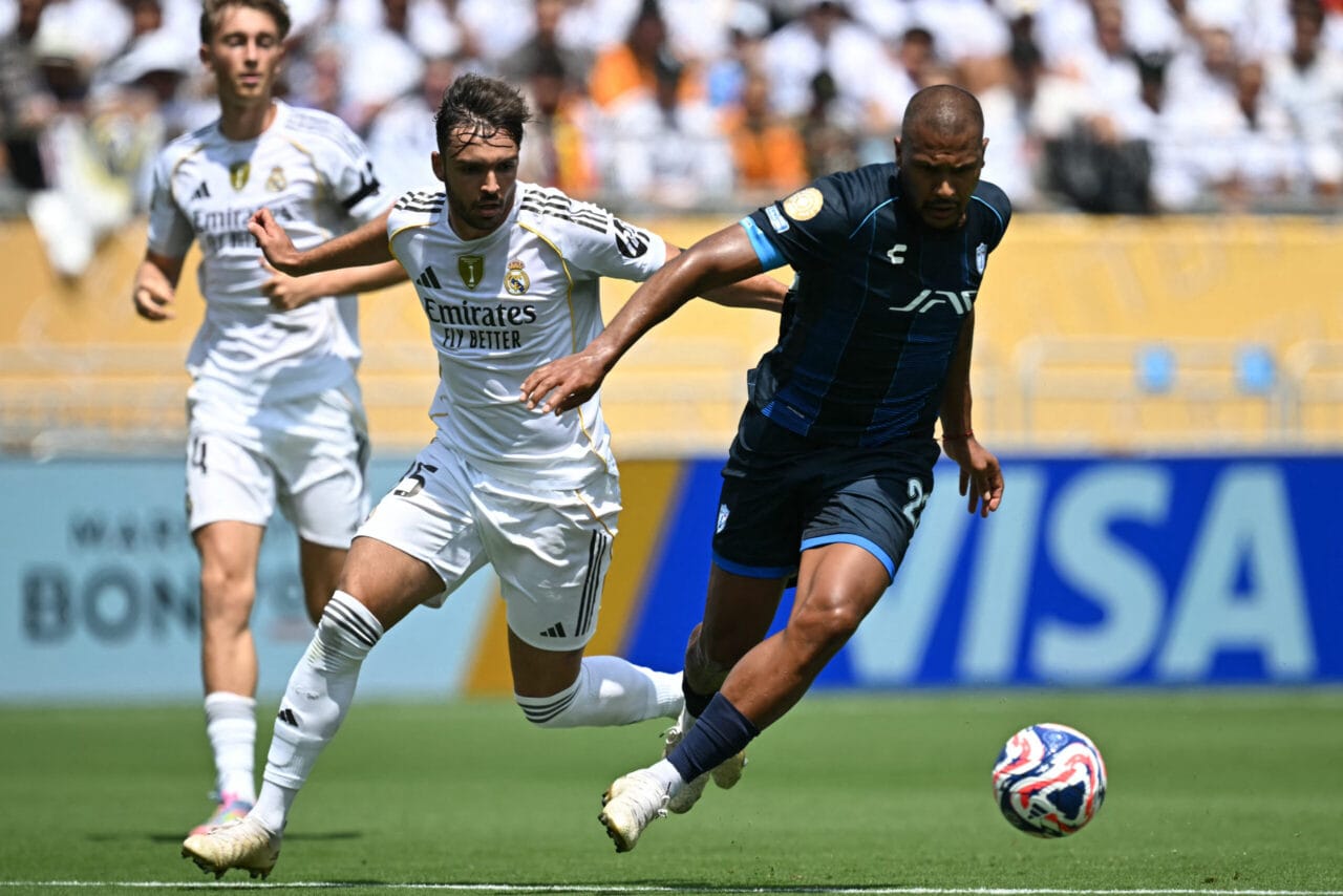 Real Madrid's Spanish defender #35 Raul Asencio (L) fights for the ball with Pachuca's Venezuelan forward #23 Salomon Rondon during the FIFA Club World Cup 2025 Group H football match between Spain's Real Madrid and Mexico's Pachuca at the Bank of America stadium in Charlotte on June 22, 2025. (Photo by Paul ELLIS / AFP)